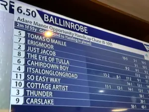 A TV screen displays the lineup for the Ballinrobe 6.50 horse race, listing horse names, jockeys, and betting odds for ten entries including Tomas O Maille, Erigmoor, Just Jacob, and others.
