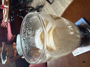 Creamy head on a perfectly poured Guinness in a pint glass